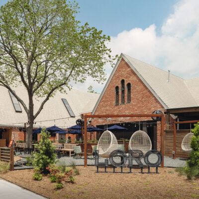 The exterior, sign, and outdoor patio of Loro Houston Heights.