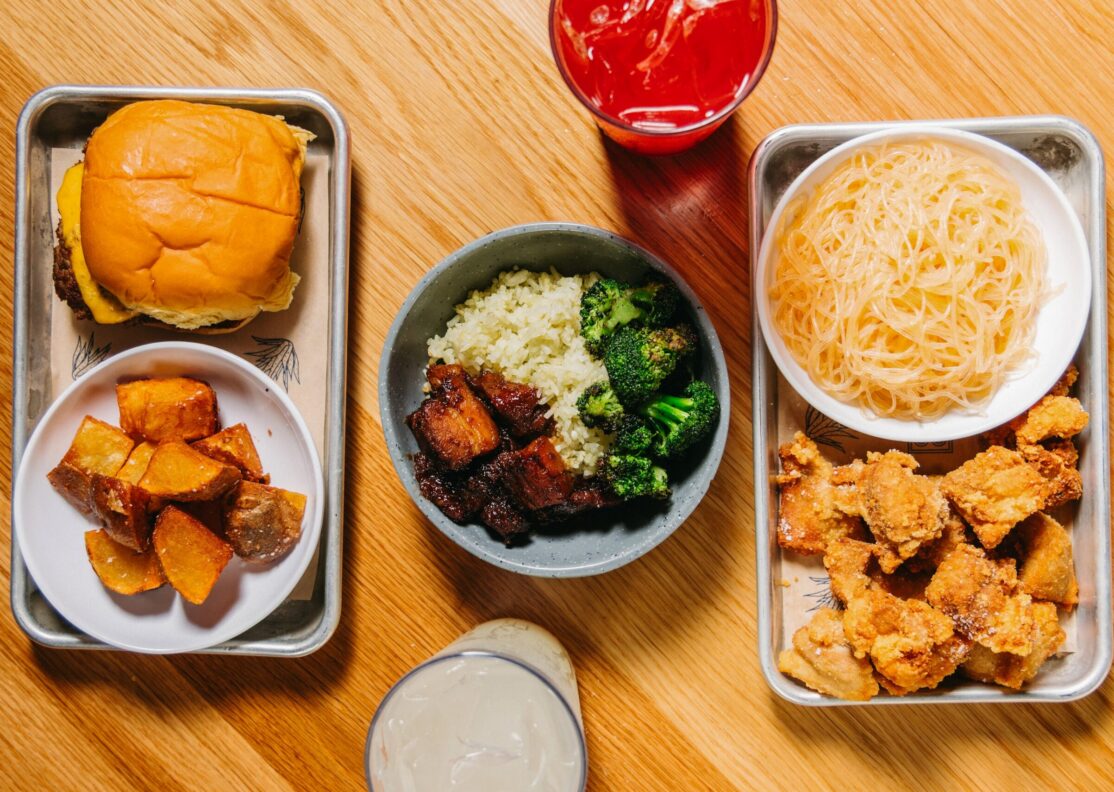 kids meals including burger and potatoes, pork rice bowl with broccoli and chicken karaage with noodles
