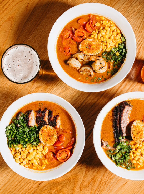three bowls of ramen, one shrimp, one pork belly and one brisket, with a glass of beer