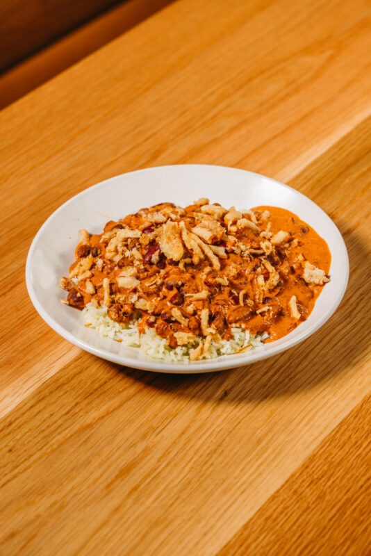 bowl of rendang curry beans over white rice